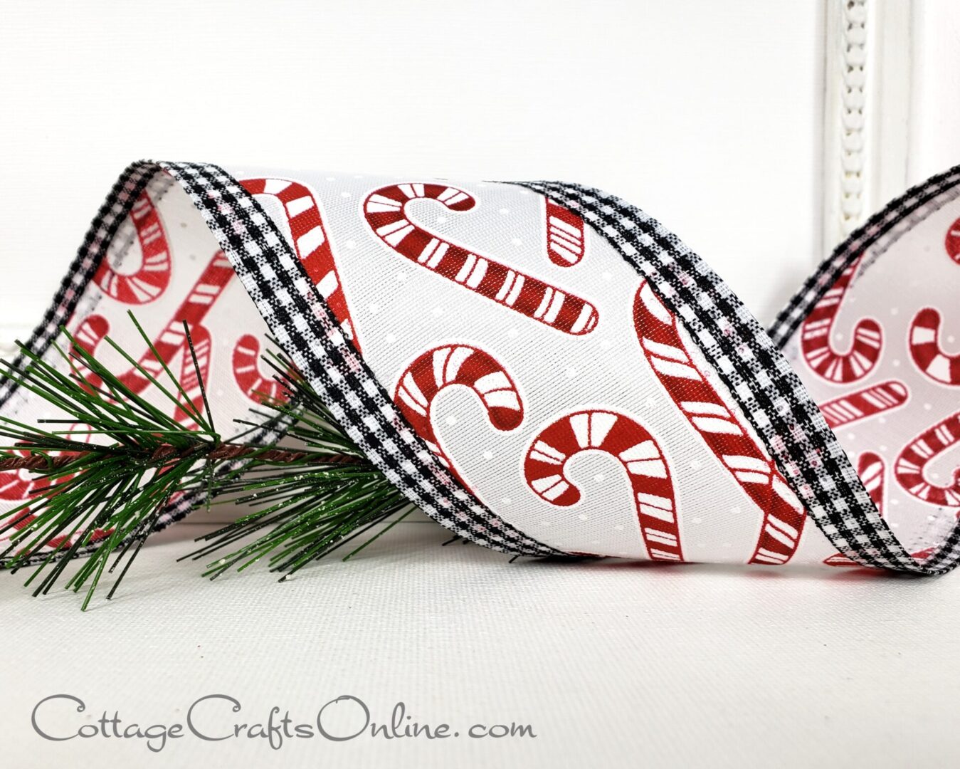 Red and white candy canes with black and white gingham edge 2.5" wide wired ribbon from the Etsy shop of Cottage Crafts Online.