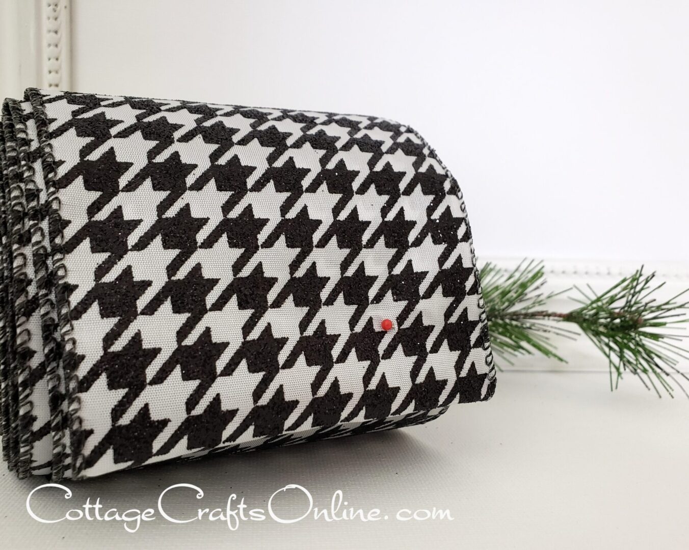 a black and white houndstooth purse on a table.
