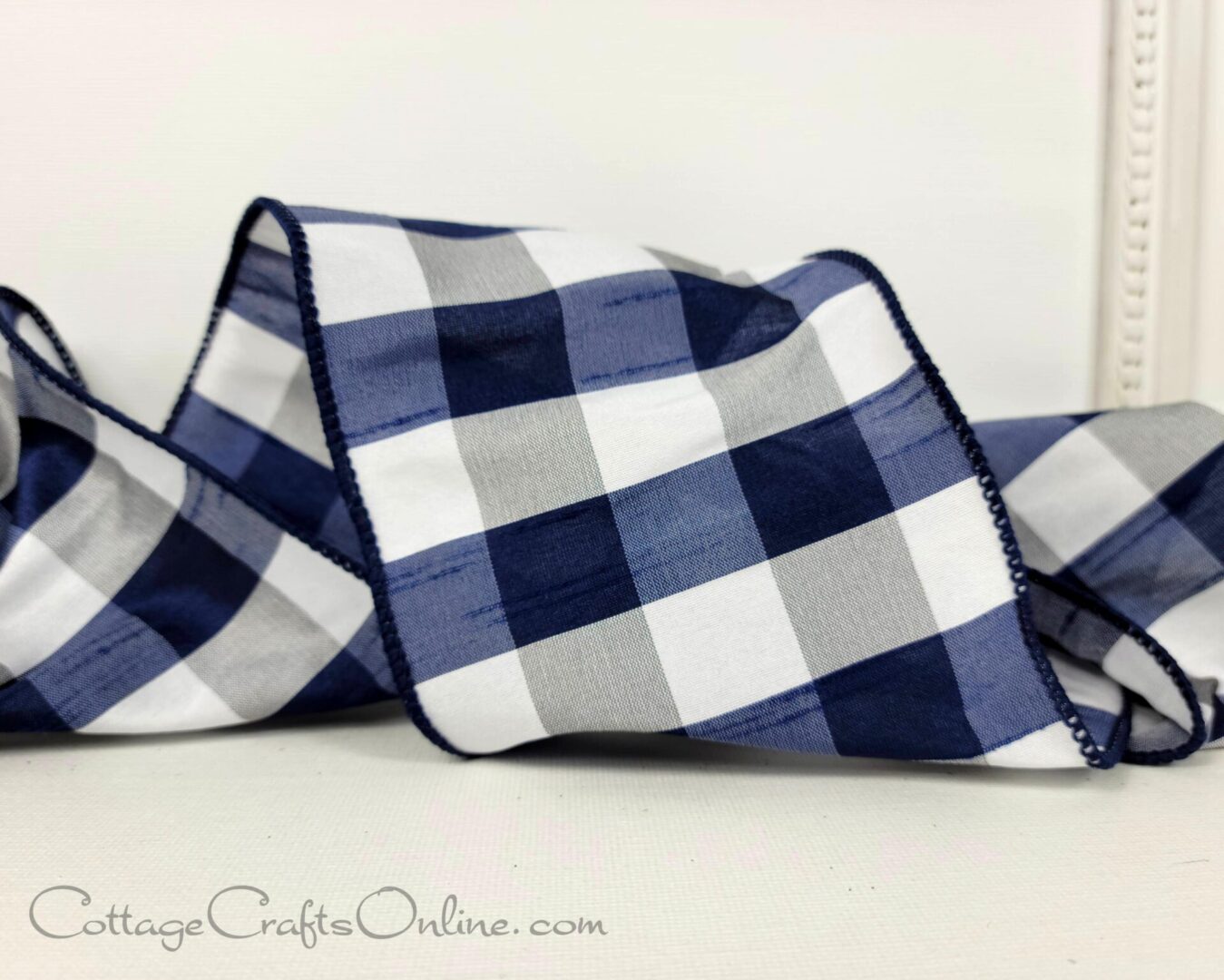 Navy blue, light grey, and white check 4" wide wired ribbon from the Etsy shop of Cottage Crafts Online.