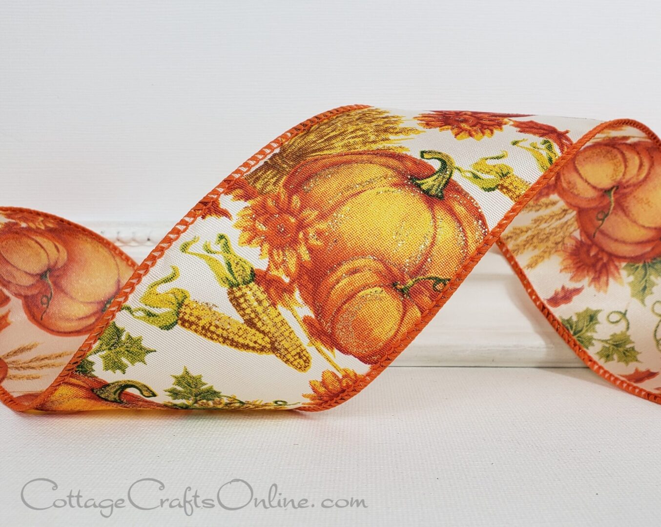 a ribbon with pumpkins and corn on it.