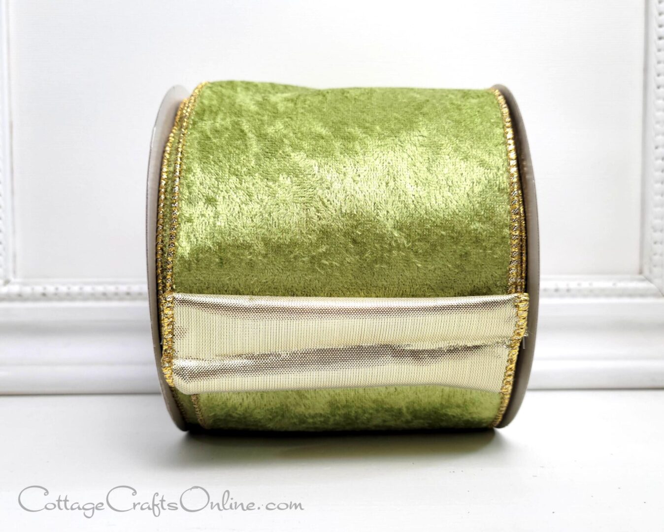 a green velvet ribbon sitting on a table, perfect for the new holiday season.