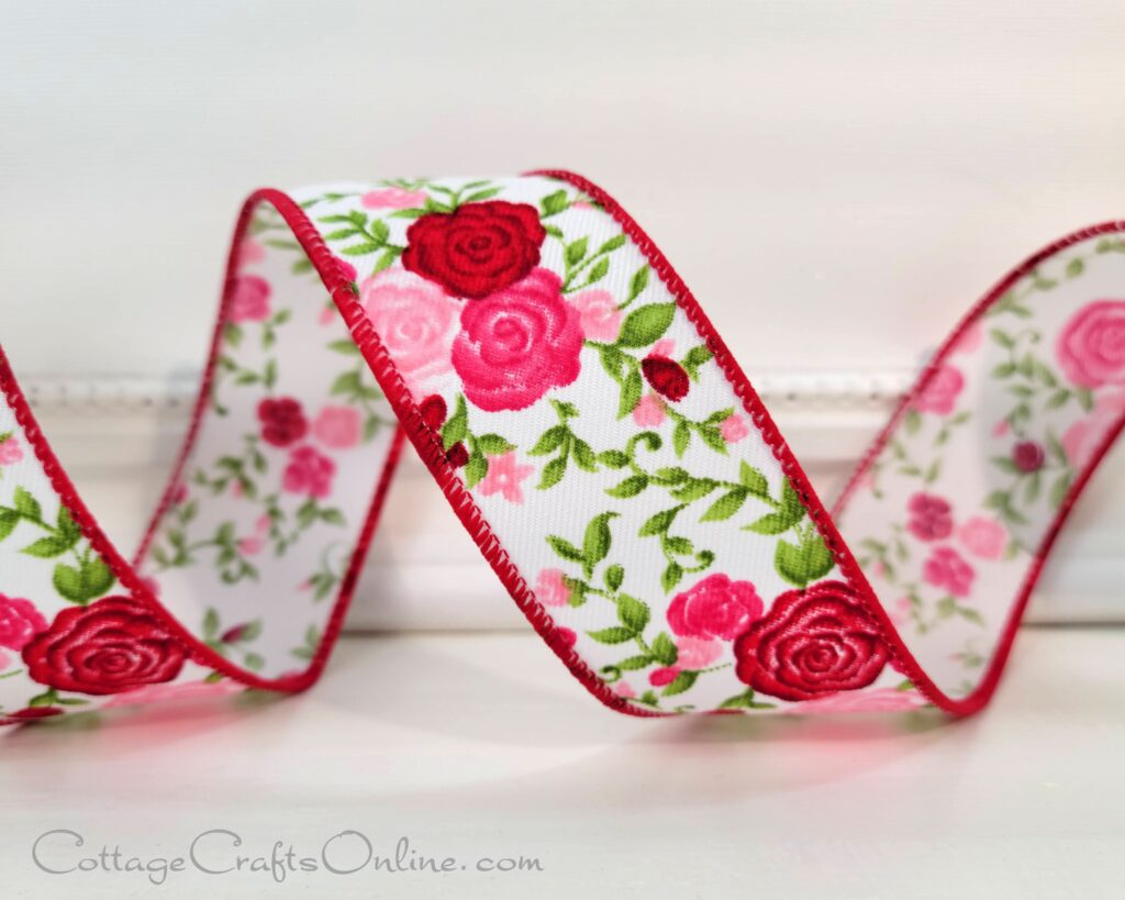 wired ribbon with small rose floral pattern in red and two shades of pink