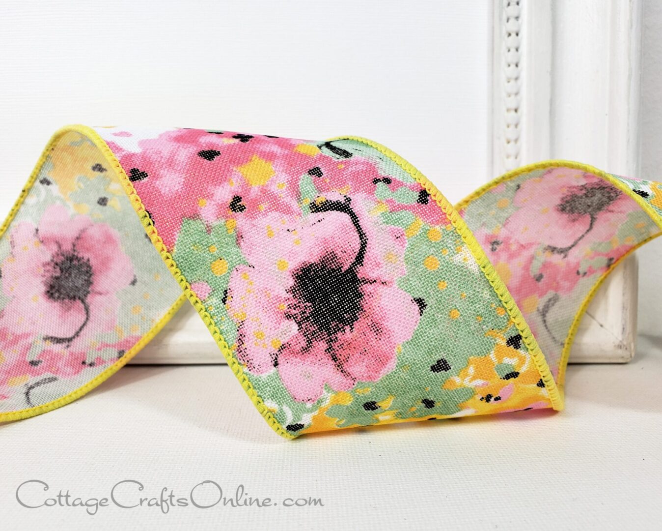 A pink ribbon with flowers available at Cottage Crafts online.