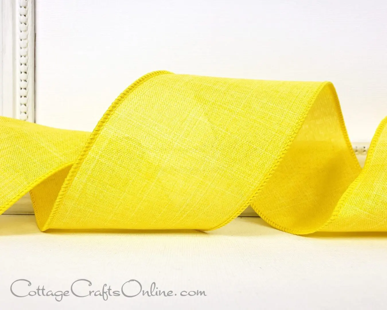 yellow linen ribbon on a white background.