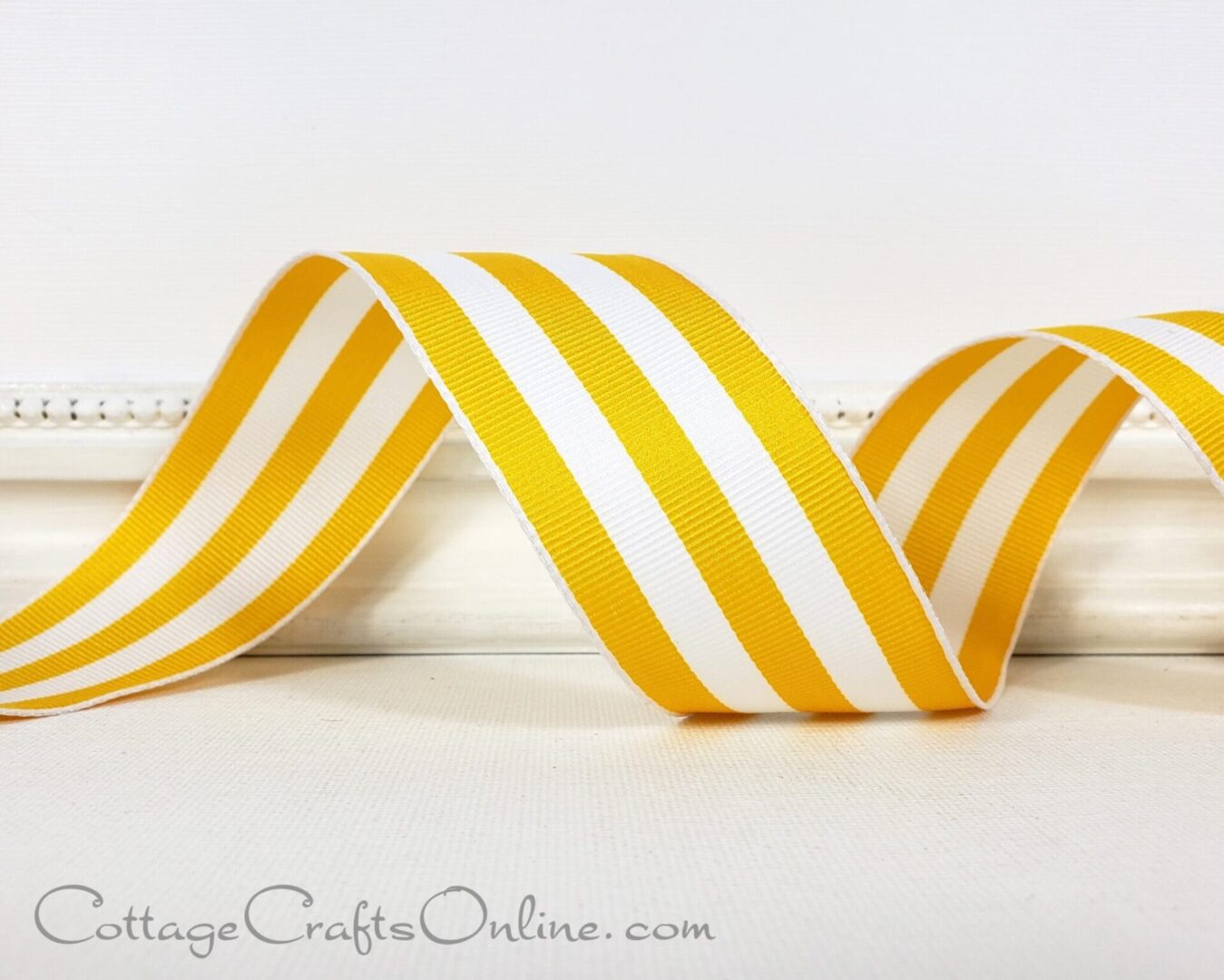 Bright yellow and white carnival stripes 1.5" wide wired ribbon from the Etsy shop of Cottage Crafts Online.