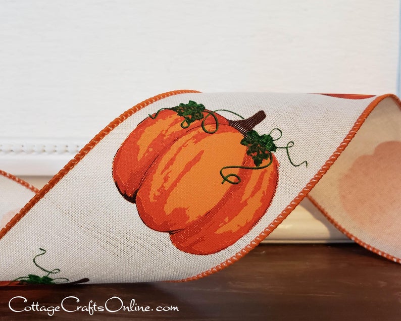 Plump orange pumpkins and green vines on cream linen 2.5" wide wired ribbon from the Etsy shop of Cottage Crafts Online.