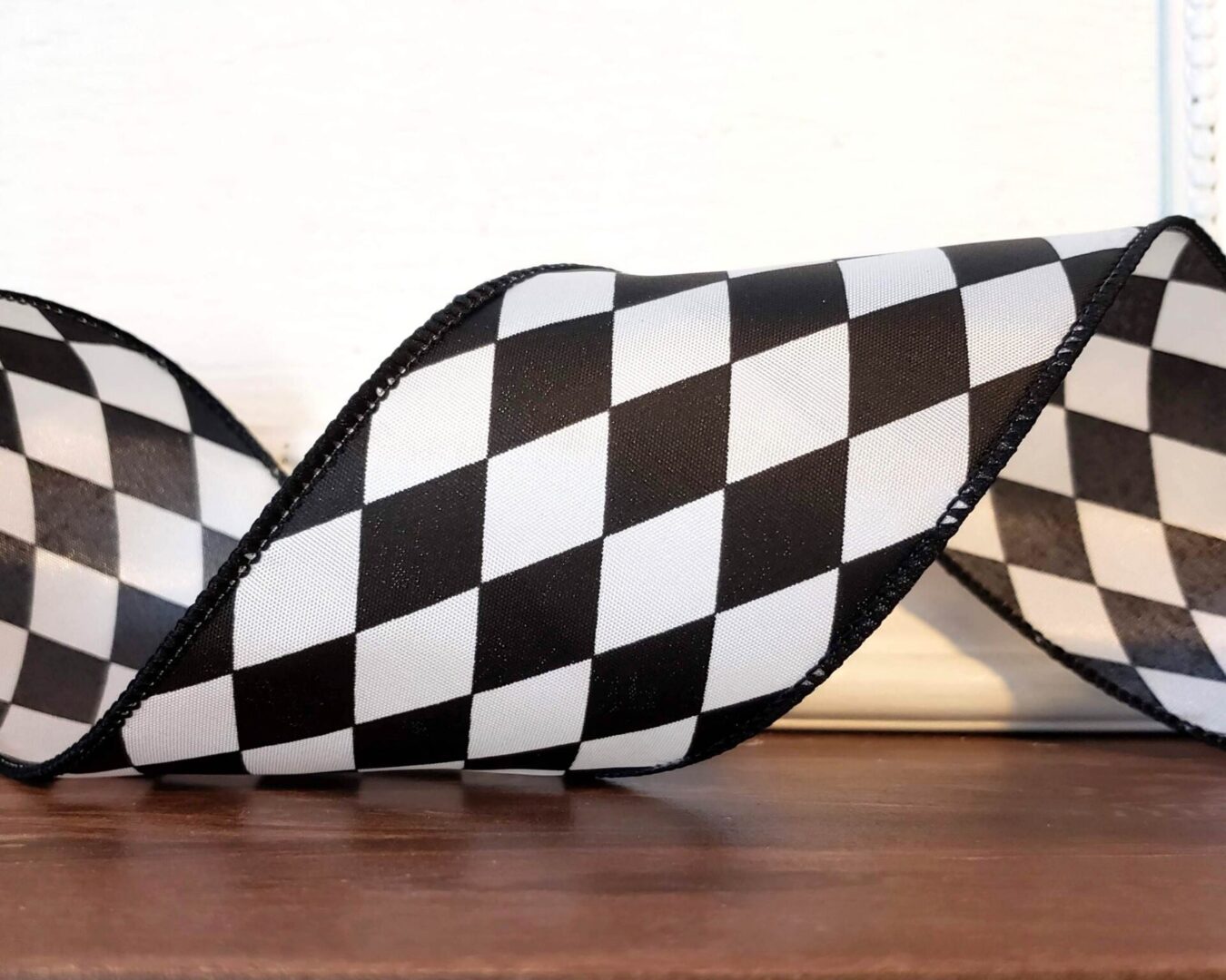 a black and white checkered ribbon on a table.