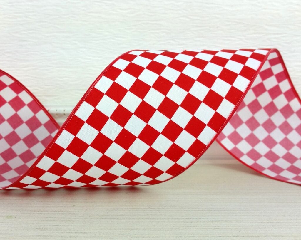 A red and white checkered ribbon is on the table.