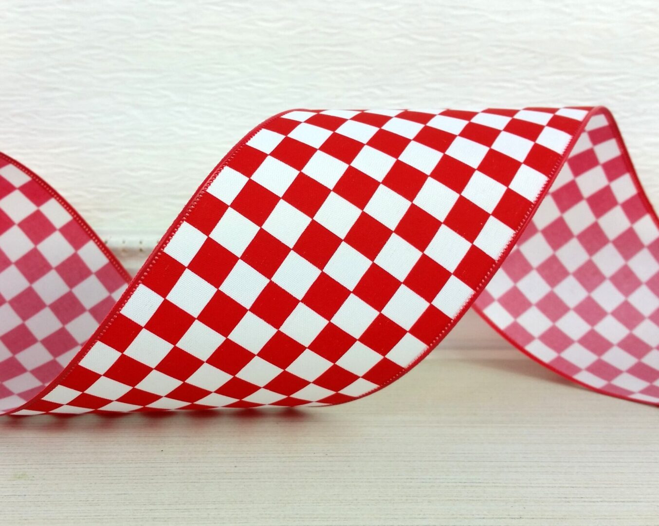 Bold red and white raceway check 2.5" wide wired ribbon from the Etsy shop of Cottage Crafts Online.