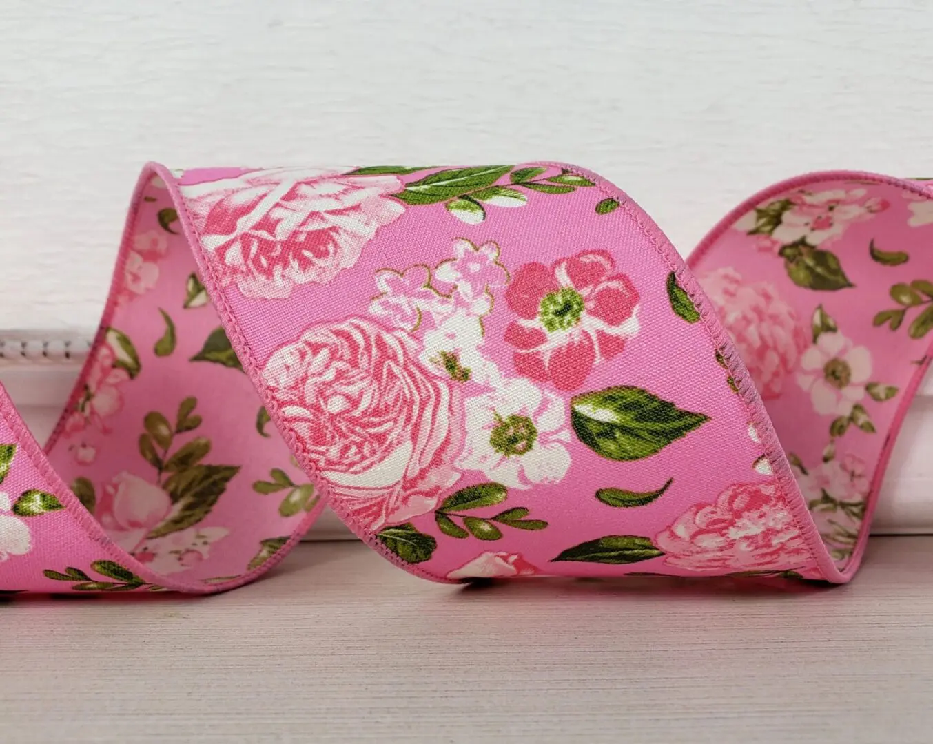Pink roses and flowers with green leaves on pink 2.5Autumn leaves on ribbed satin with gold glitter 2.5" wide wired ribbon from the Etsy shop of Cottage Crafts Online.