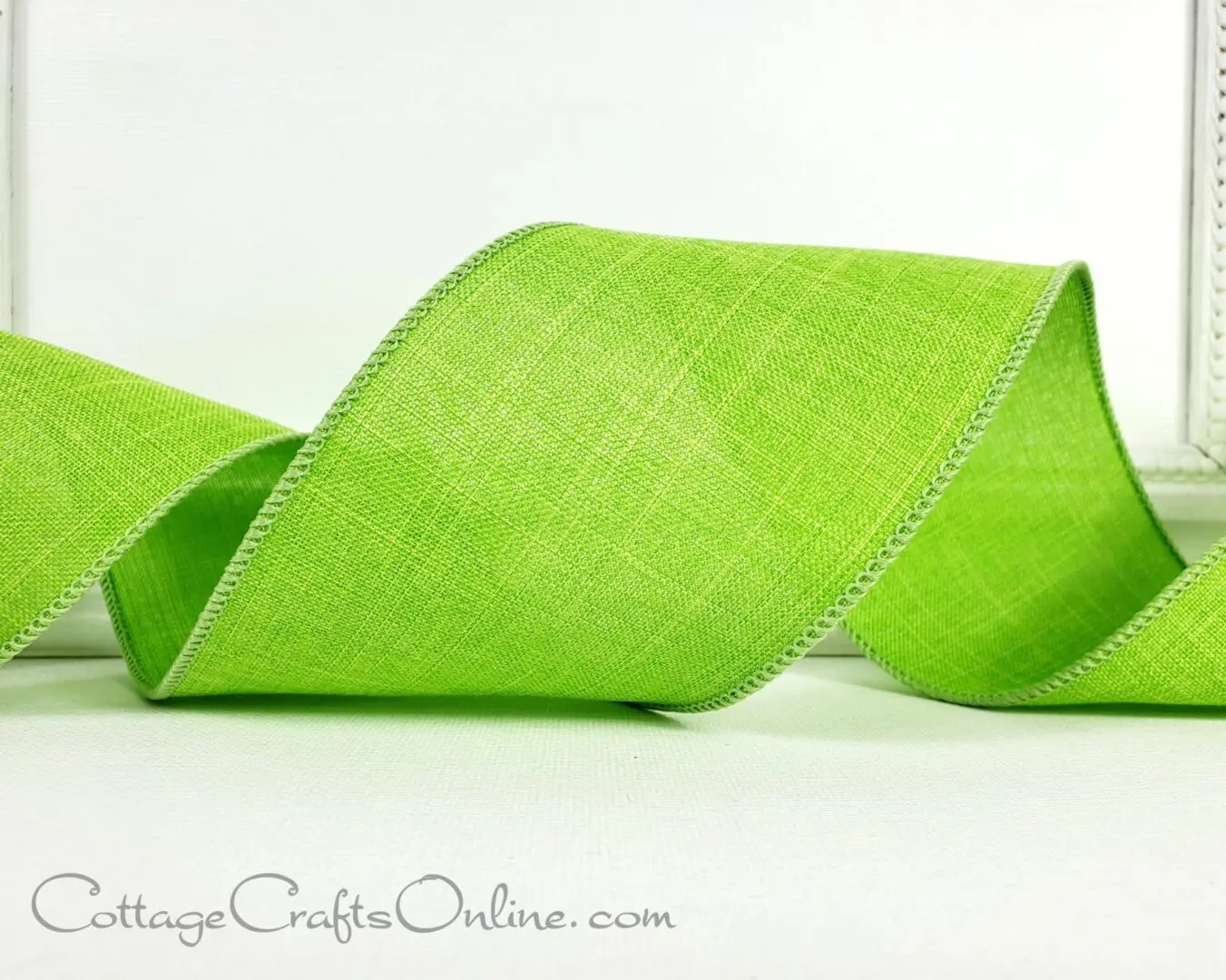 green linen ribbon on a white background.