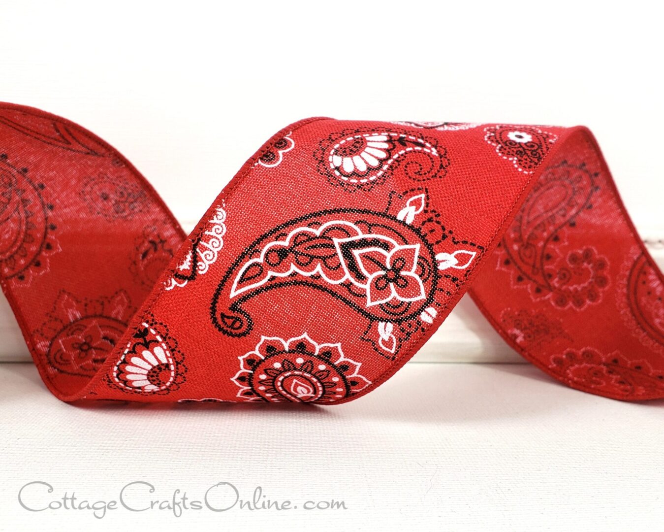 A red ribbon with bandana prints