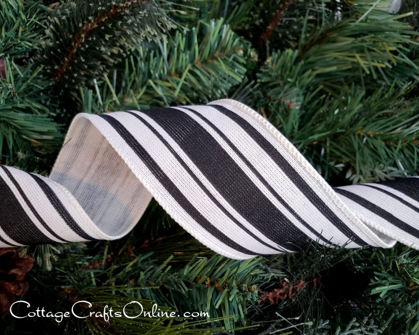 black and grey striped ribbon on a christmas tree.