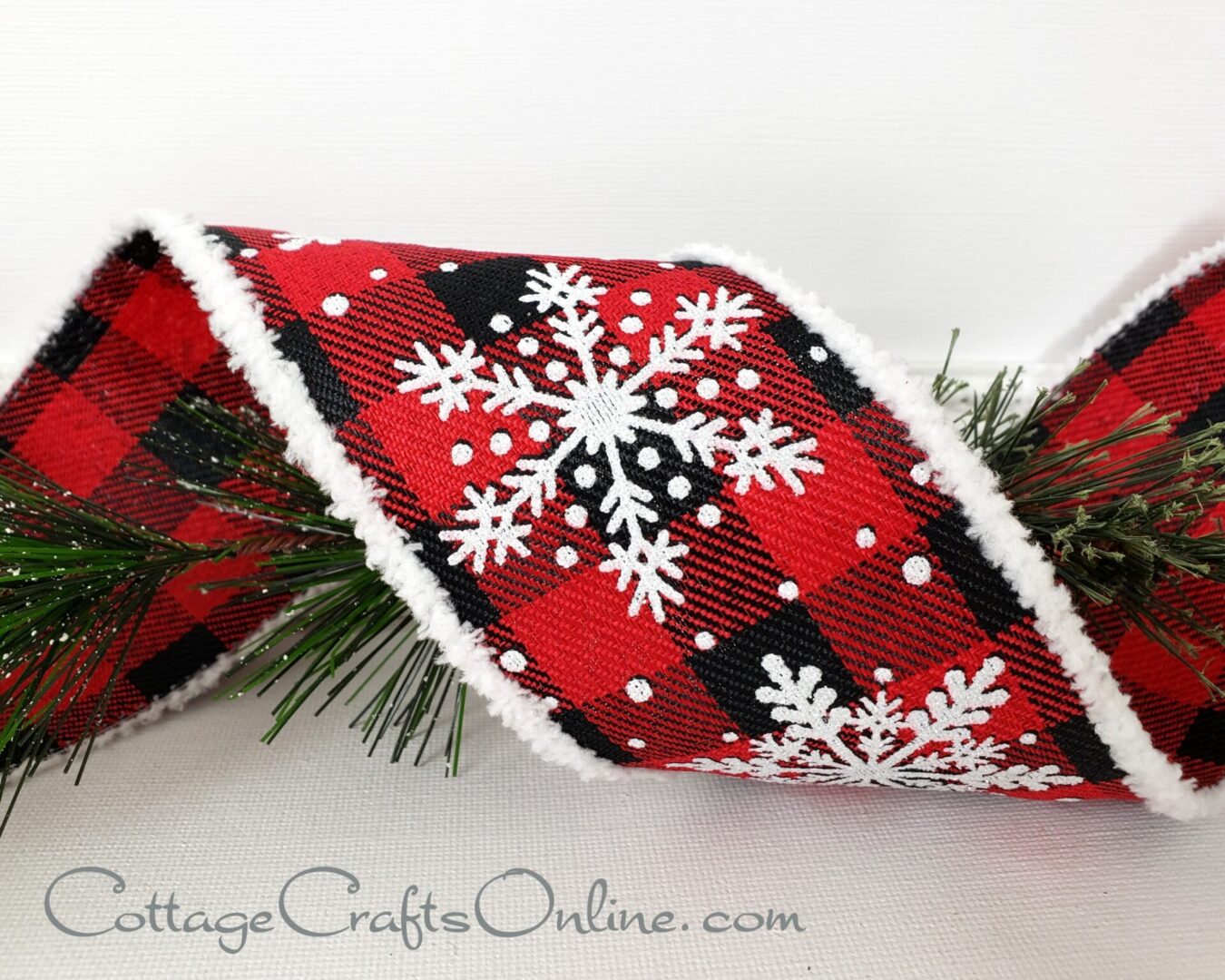 White snowflakes on red and black buffalo plaid with white chenille edge 2.5" wide wired ribbon from the Etsy shop of Cottage Crafts Online.