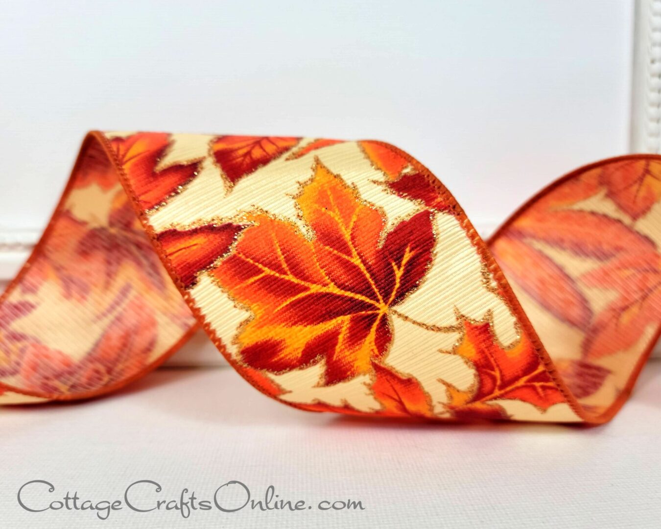 Autumn leaves on ribbed satin with gold glitter 2.5" wide wired ribbon from the Etsy shop of Cottage Crafts Online.