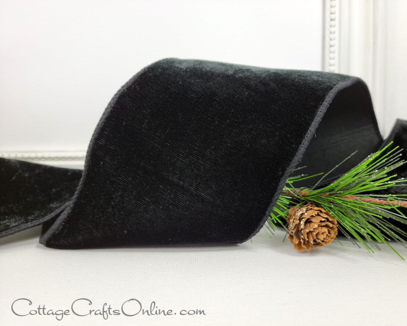 Plush black velvet with black taffeta back 4" wide wired ribbon from the Etsy shop of Cottage Crafts Online.