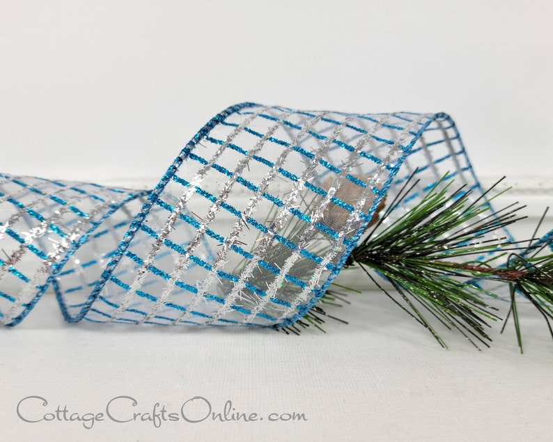 Blue and silver glitter grid on white sheer 2.5" wide wired ribbon from the Etsy shop of Cottage Crafts Online.