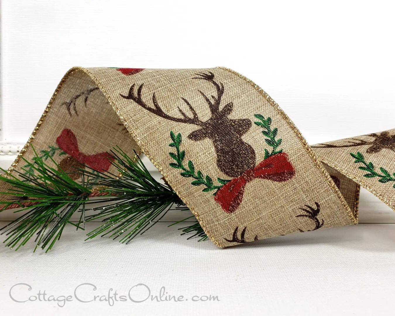 Deer head silhouettes with red bows and laurel on tan 2.5" wide wired ribbon from the Etsy shop of Cottage Crafts Online.
