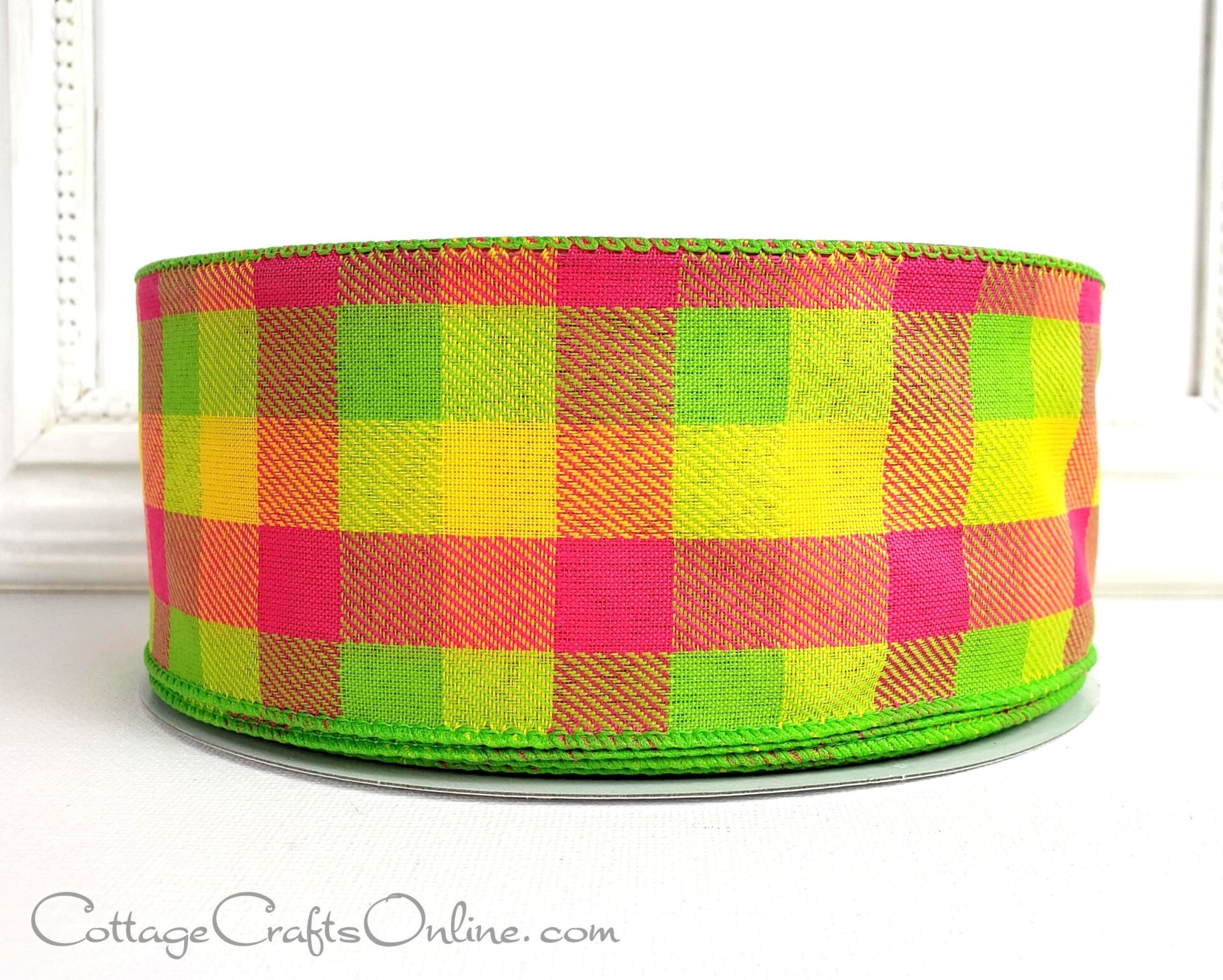 A close up of the ribbon on a green and yellow plaid ribbon