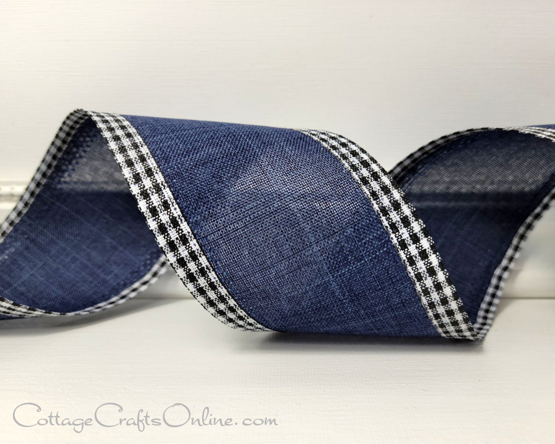 A blue ribbon with black and white gingham trim.