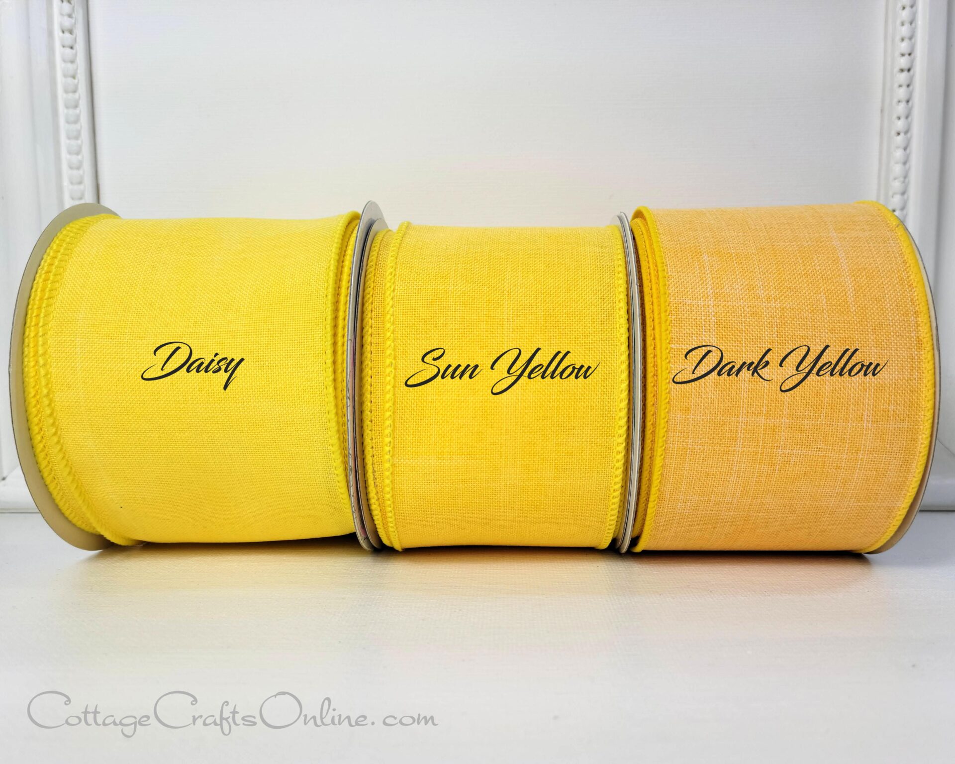 Three yellow towels with names on them.