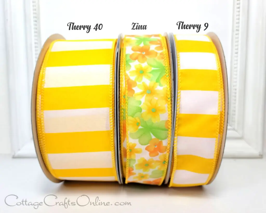 A yellow and white striped ribbon with flowers on it.