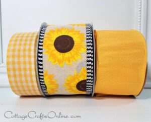 Sunflower design on white ribbon and a plain yellow ribbon