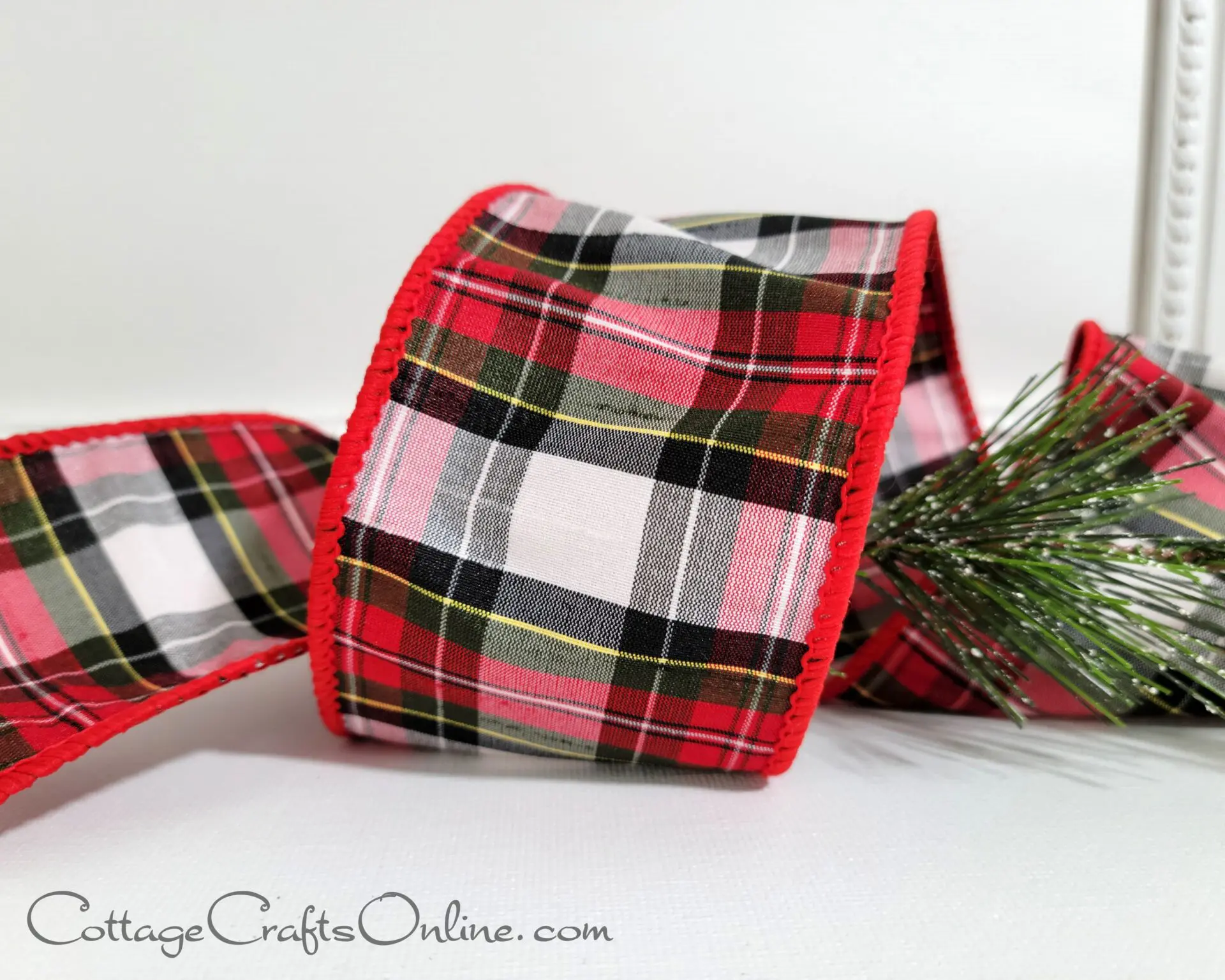 A festive plaid ribbon featuring a Christmas tree design, perfect for the t2022 holiday season.