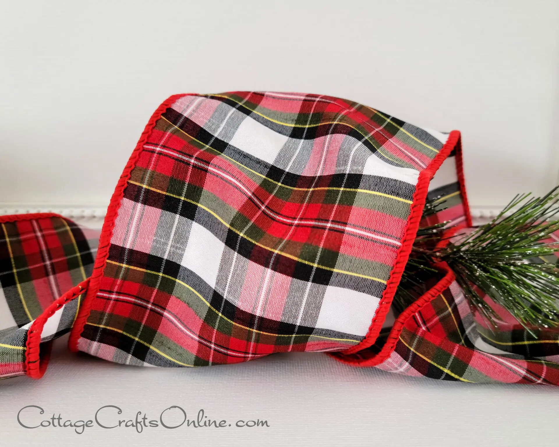 A close up of a red and white plaid ribbon