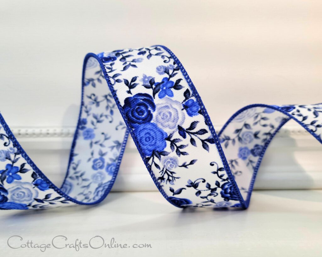 A blue and white ribbon with flowers on it