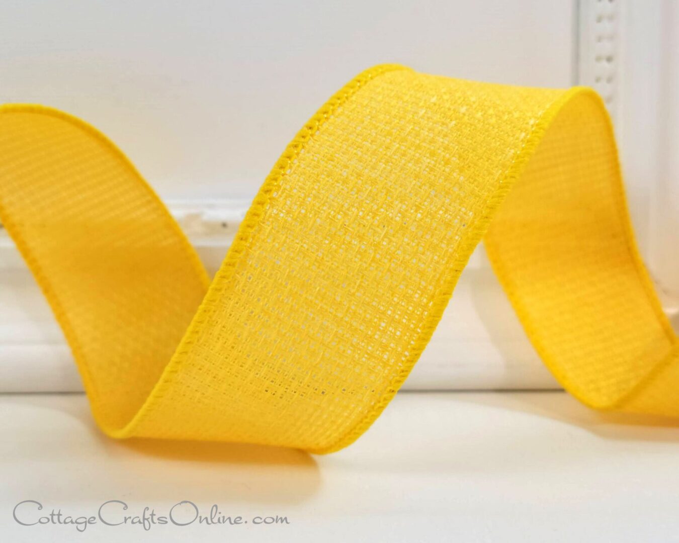 A yellow ribbon is sitting on top of a table.