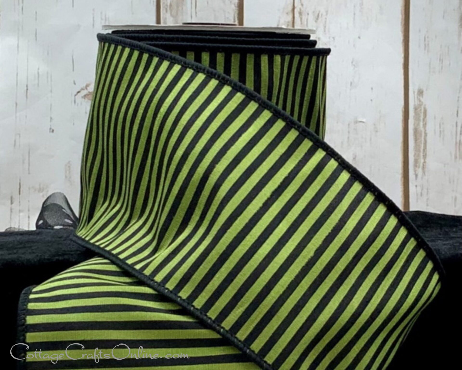 A close up of a green and black striped ribbon