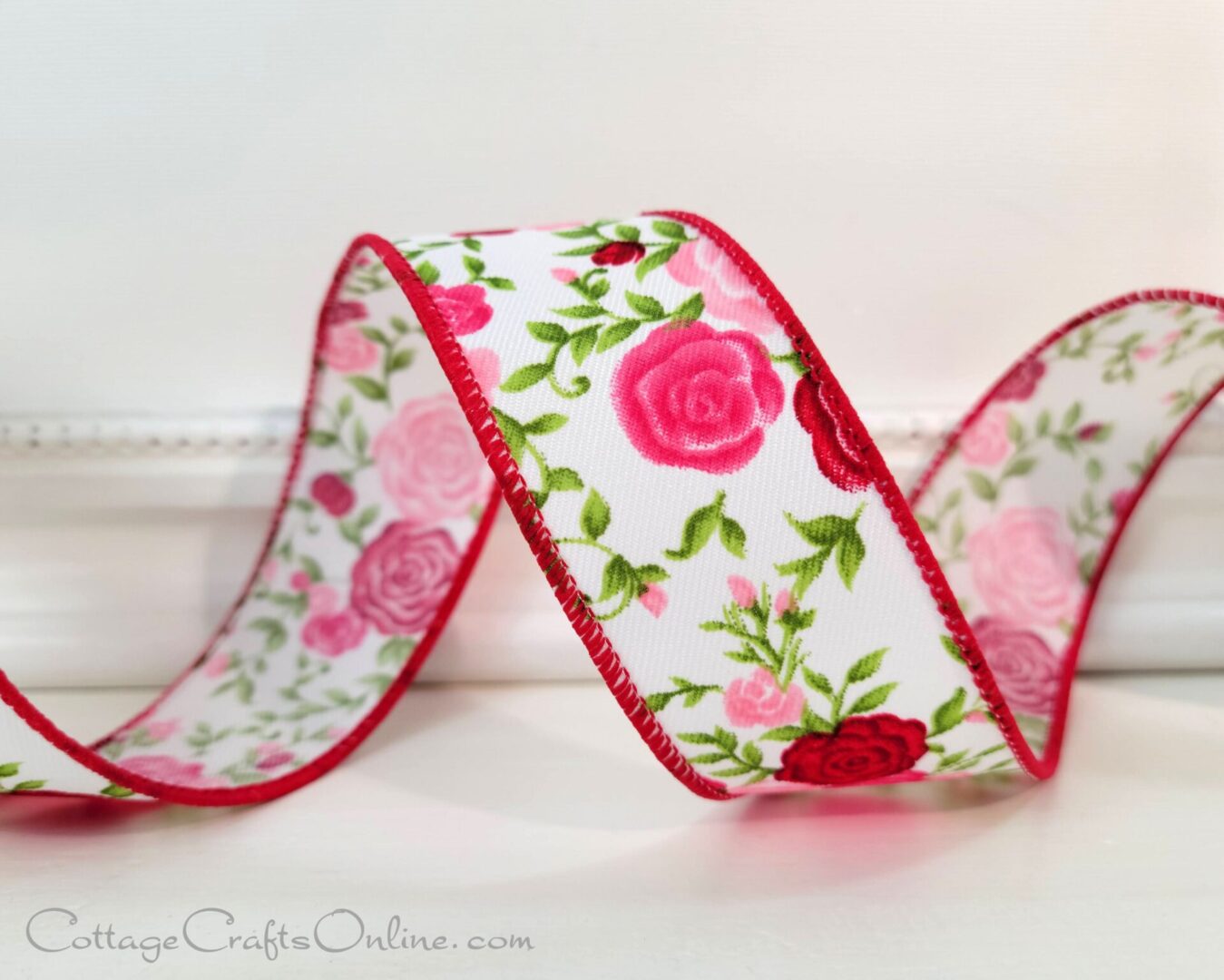 A close up of a ribbon with roses on it