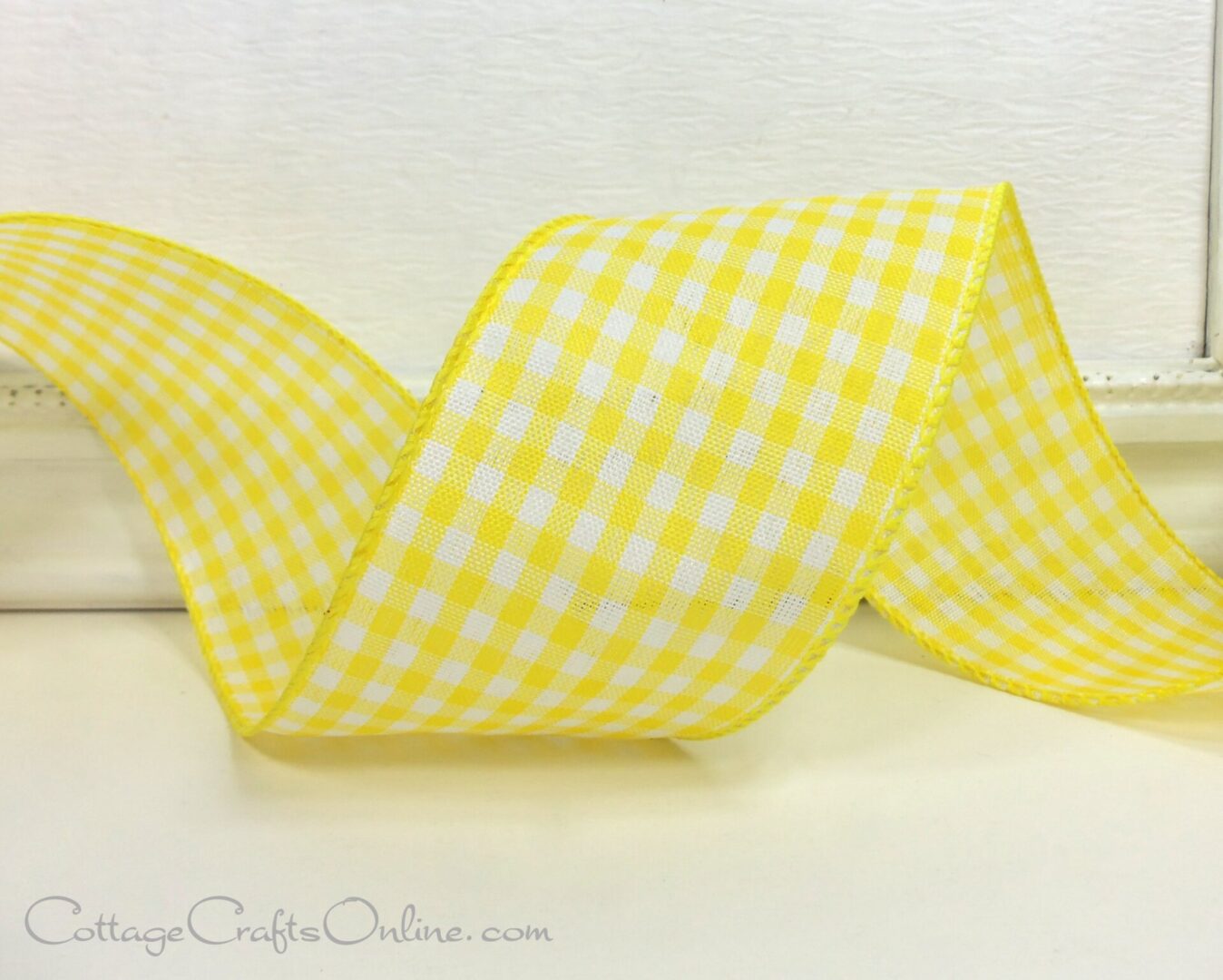 A yellow ribbon with white gingham on it.