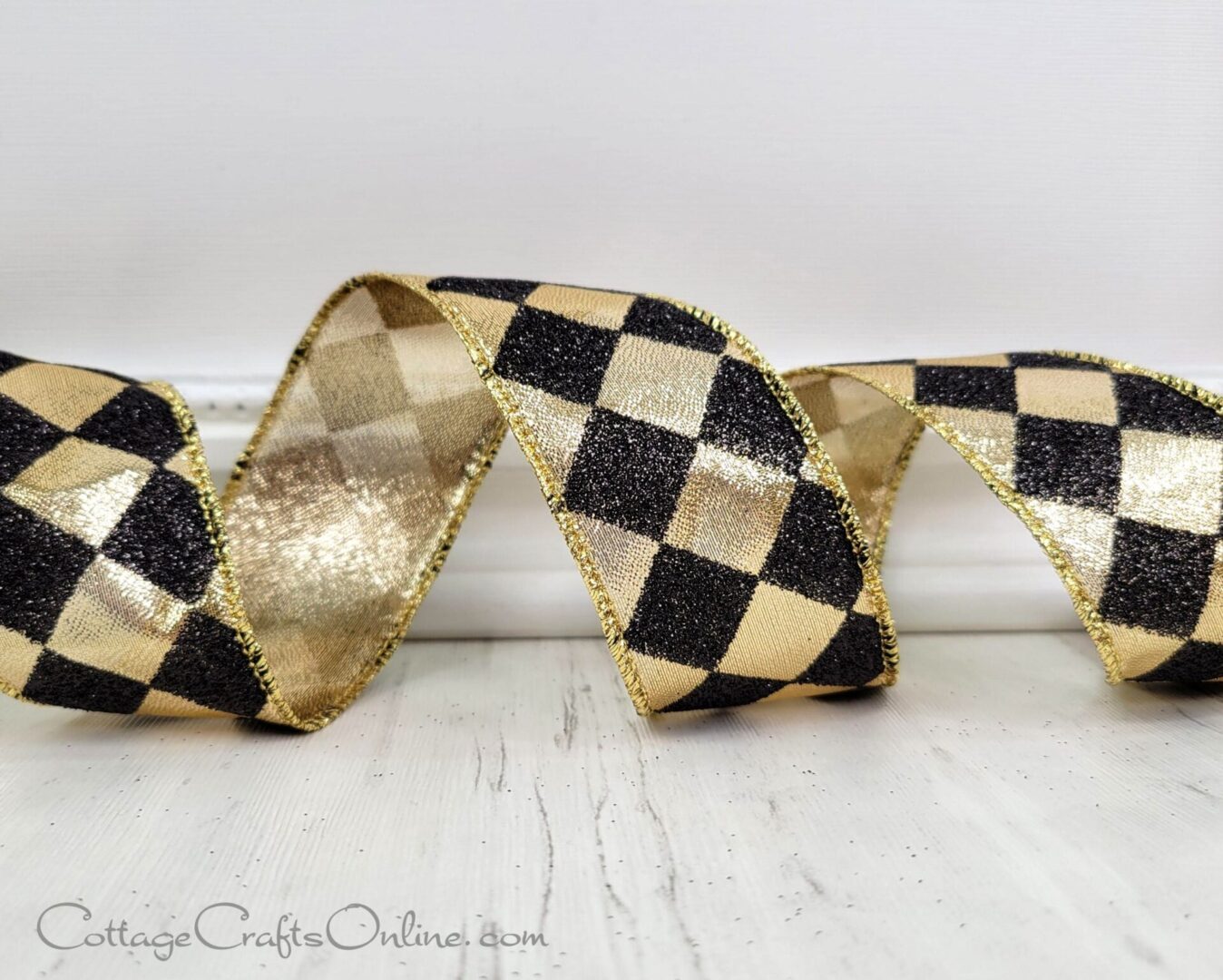 A black and gold checkered ribbon sitting on top of a table.