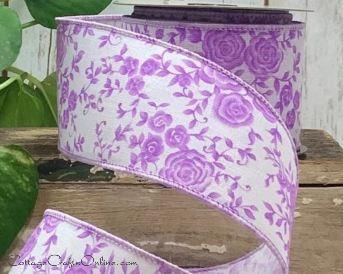 A purple ribbon with flowers on it
