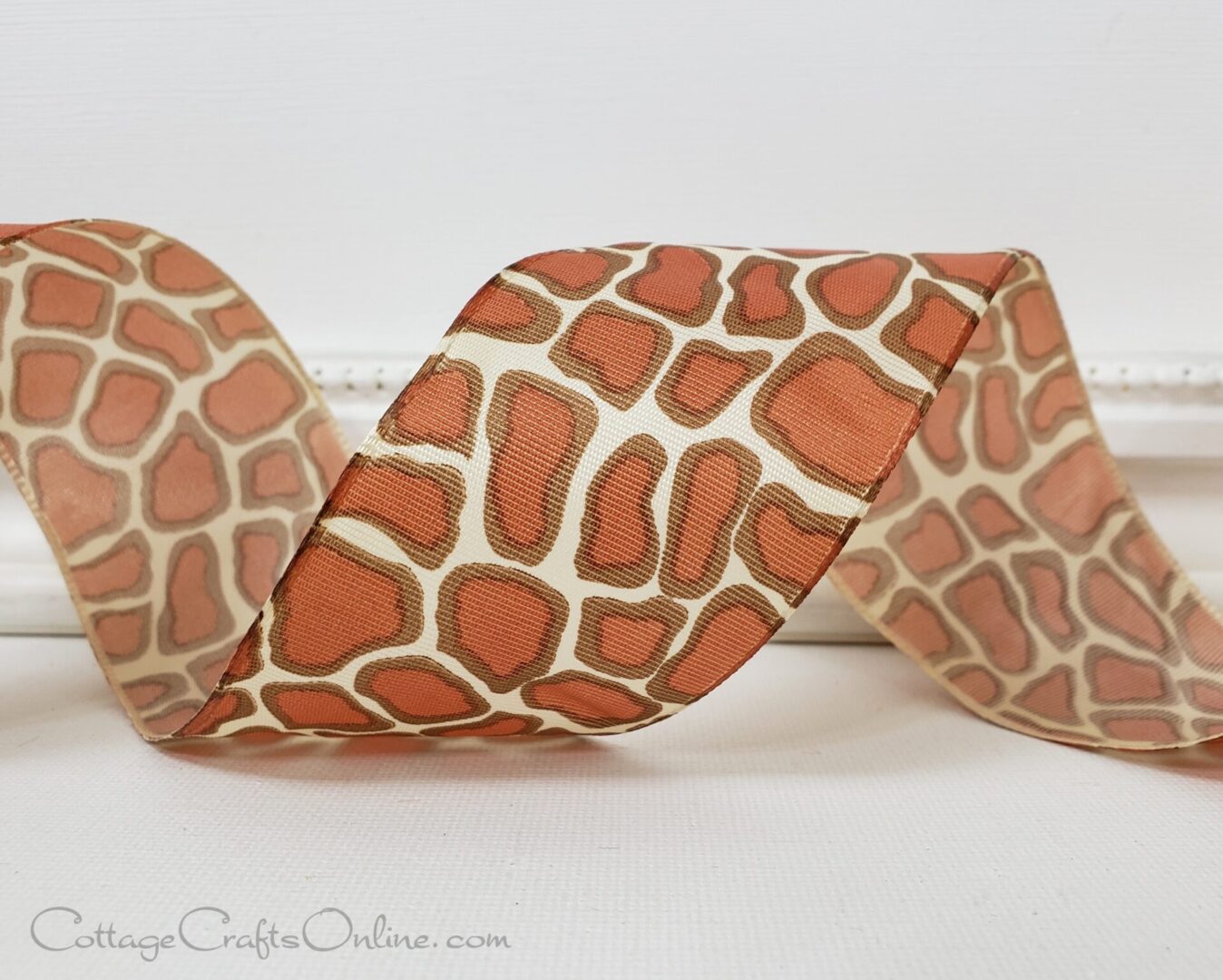 A giraffe print ribbon is sitting on top of a table.