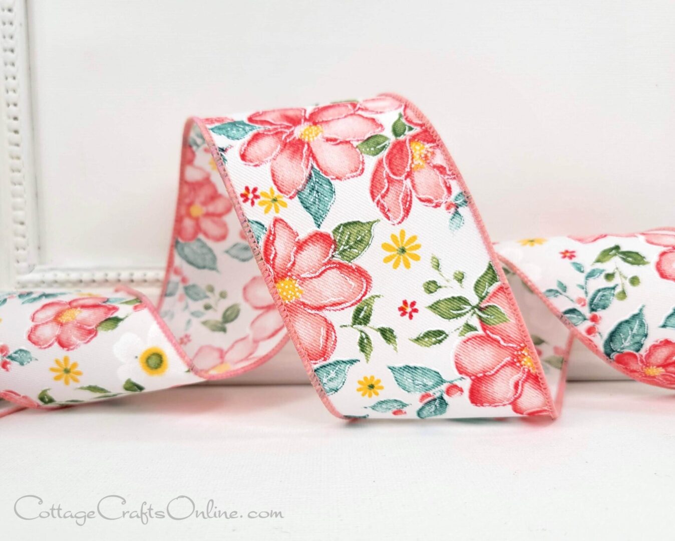 A close up of a ribbon with flowers on it