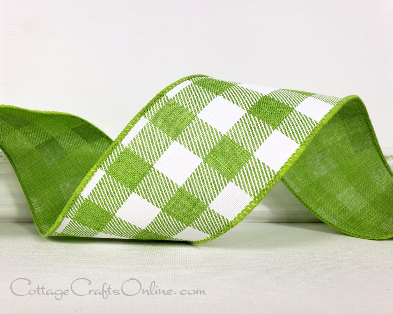 A close up of the ribbon on a green and white plaid ribbon