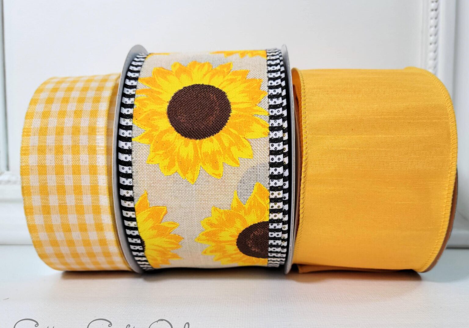 A yellow towel with sunflowers on it